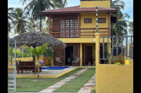 Casa amarela flecheiras